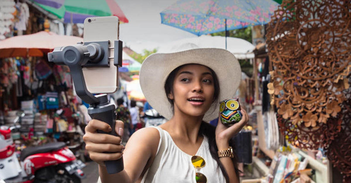 Woman using DJI Osmo 2 in a Market